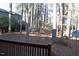 Backyard and wooded area with trees visible from the back deck at 106 Weatherstone Dr # B, Chapel Hill, NC 27514