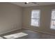 Bedroom with natural light, two windows, and a ceiling fan at 106 Weatherstone Dr # B, Chapel Hill, NC 27514