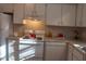 Kitchen featuring white appliances and cabinets with granite countertops, providing a functional and appealing cooking space at 106 Weatherstone Dr # B, Chapel Hill, NC 27514