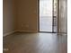 Living room with sliding door and neutral paint at 106 Weatherstone Dr # B, Chapel Hill, NC 27514
