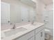 Stylish bathroom features double sinks, large mirror, and shower-tub combo at 112 Pisgah St, Sanford, NC 27330