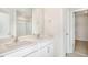 Bathroom features a double vanity, a large mirror, and a glass enclosed shower at 112 Pisgah St, Sanford, NC 27330