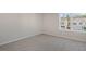 Bright bedroom features neutral carpet, a large window and natural light at 112 Pisgah St, Sanford, NC 27330