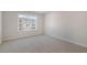 Bright bedroom with a large window, plush carpet, and neutral walls for a relaxing atmosphere at 112 Pisgah St, Sanford, NC 27330