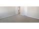 Spacious bedroom with neutral carpeting, light walls, and bright white trim create a welcoming atmosphere at 112 Pisgah St, Sanford, NC 27330