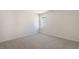 This is a clean, carpeted bedroom with a single window at 112 Pisgah St, Sanford, NC 27330
