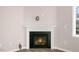 Cozy fireplace with a white mantel and a black surround, creating a warm focal point at 112 Pisgah St, Sanford, NC 27330