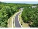 Street view showcases the paved road and the surrounding landscape at 112 Pisgah St, Sanford, NC 27330