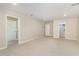 Large bonus room featuring neutral carpeting and multiple entryways for flexible living space at 121 Mason Oaks Dr, Wake Forest, NC 27587