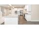 Open kitchen with white cabinetry, stainless steel appliances and an eat-in island at 121 Mason Oaks Dr, Wake Forest, NC 27587