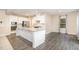 Bright kitchen with granite countertops, stainless steel appliances, and a large center island at 121 Mason Oaks Dr, Wake Forest, NC 27587