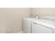Functional laundry room featuring a washing machine and dryer at 121 Mason Oaks Dr, Wake Forest, NC 27587