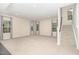 Spacious living room featuring plush carpet, recessed lighting, and three large windows with stylish curtains at 121 Mason Oaks Dr, Wake Forest, NC 27587