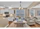 Bright dining area with large windows and hardwood floors adjacent to the open concept kitchen at 1252 Magic Hollow Rd, Durham, NC 27713