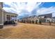 Spacious backyard with a patio, screened porch, and lush lawn, offering plenty of room for recreation at 1530 Armscroft Ln, Apex, NC 27502