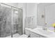 Modern bathroom featuring a glass-enclosed shower, sleek fixtures, and a clean aesthetic at 1530 Armscroft Ln, Apex, NC 27502