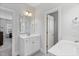 Modern bathroom showcasing a white vanity with a mirror and large doorway at 1530 Armscroft Ln, Apex, NC 27502