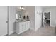 Bathroom with a granite countertop sink and a view to an exercise area at 1530 Armscroft Ln, Apex, NC 27502