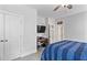 Spacious bedroom featuring a blue bed, ceiling fan and entry to bathroom at 1530 Armscroft Ln, Apex, NC 27502