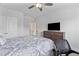Neutral bedroom featuring a large dresser and television with a view to bathroom at 1530 Armscroft Ln, Apex, NC 27502
