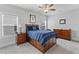 Bedroom with a light blue color scheme, a wooden bed frame and matching nightstands at 1530 Armscroft Ln, Apex, NC 27502