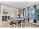 Dining room with hardwood floors, large windows and an elegant chandelier at 1530 Armscroft Ln, Apex, NC 27502