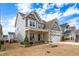 Inviting two-story home with a well-manicured lawn and attached two-car garage at 1530 Armscroft Ln, Apex, NC 27502