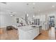 Bright, open-concept kitchen with a large island and white cabinetry at 1530 Armscroft Ln, Apex, NC 27502