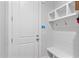 Convenient mudroom entrance with built-in storage and seating, ideal for organizing everyday essentials at 1530 Armscroft Ln, Apex, NC 27502