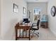 Bright home office with a large window, providing ample natural light for a productive workspace at 1530 Armscroft Ln, Apex, NC 27502