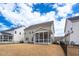Well-maintained home featuring a screened porch, patio, and lush backyard, providing ample outdoor space at 1530 Armscroft Ln, Apex, NC 27502