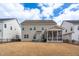 Attractive home showcasing a screened porch, patio, and spacious yard, perfect for relaxation and gatherings at 1530 Armscroft Ln, Apex, NC 27502