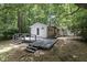 Backyard with a wooden deck and stairs at 1706 Us Hwy 70A E, Hillsborough, NC 27278