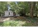 Spacious backyard with mature trees and a deck at 1706 Us Hwy 70A E, Hillsborough, NC 27278