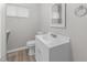 Bathroom features a white vanity, modern sink, and a toilet with contemporary finishes at 1706 Us Hwy 70A E, Hillsborough, NC 27278