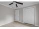 Bedroom with wood-look floors, ceiling fan, and a closet to maximize storage space at 1706 Us Hwy 70A E, Hillsborough, NC 27278