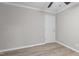 Bedroom with neutral paint, modern flooring, ceiling fan and a standard door at 1706 Us Hwy 70A E, Hillsborough, NC 27278