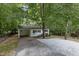 Single-story home with a car port and gravel driveway at 1706 Us Hwy 70A E, Hillsborough, NC 27278