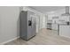 Modern kitchen features stainless steel appliances, granite counters, white cabinets, and a view of the dining area at 1706 Us Hwy 70A E, Hillsborough, NC 27278