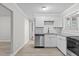 Modern kitchen features stainless steel appliances, granite counters, white cabinets, and a subway tile backsplash at 1706 Us Hwy 70A E, Hillsborough, NC 27278