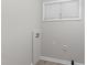 A well-lit laundry area featuring connections for washer and dryer and modern flooring at 1706 Us Hwy 70A E, Hillsborough, NC 27278