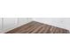 Close-up on room interior showcasing the beautiful hardwood flooring and trim details along the baseboard and wall at 1785 Birdhaven Ln, Wendell, NC 27591