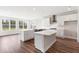 New kitchen boasts two islands, stainless appliances, gas range, and white subway tile backsplash at 1785 Birdhaven Ln, Wendell, NC 27591