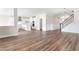 Inviting living space with hardwood floors, large windows, and a kitchen featuring an island and modern appliances at 1785 Birdhaven Ln, Wendell, NC 27591