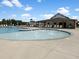 Community pool area featuring a baby pool, lounge seating, and covered dining area at 1785 Birdhaven Ln, Wendell, NC 27591