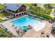 Community swimming pool with lap lanes, slide, splash area, lounge chairs, and umbrellas at 1785 Birdhaven Ln, Wendell, NC 27591