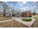 Beautiful home featuring a large backyard with a patio and lots of trees at 1837 Shamrock Dr, Burlington, NC 27215