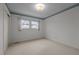 Minimalist bedroom with carpet, single window, and a closet with sliding doors at 1837 Shamrock Dr, Burlington, NC 27215