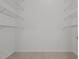 This walk-in closet offers multiple shelves and carpet at 1837 Shamrock Dr, Burlington, NC 27215