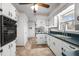 Well-equipped kitchen with vintage-style cabinetry, modern appliances, and easy access to adjacent rooms for seamless living at 1837 Shamrock Dr, Burlington, NC 27215